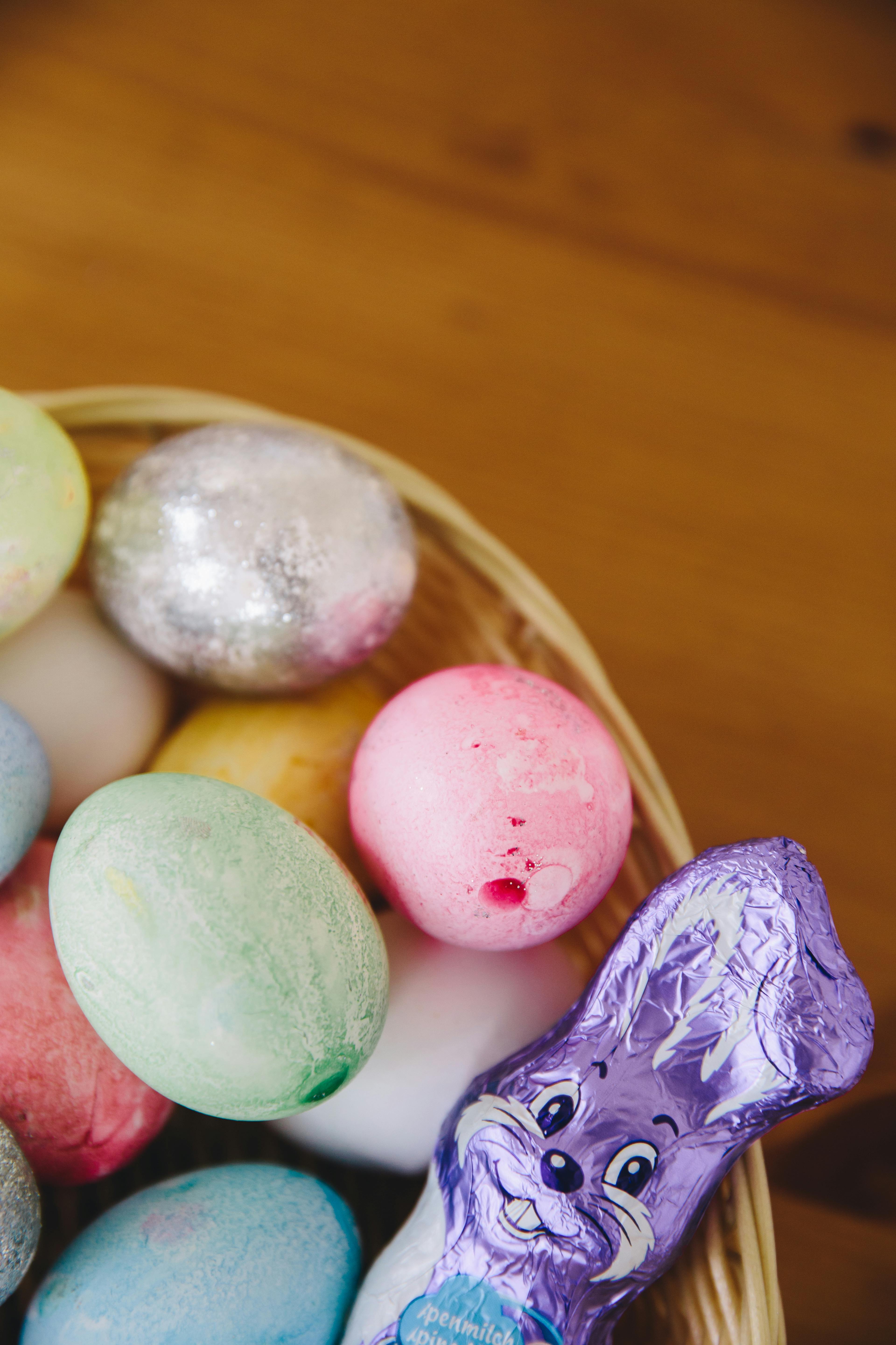 pastel colored easter eggs and chocolate rabbit