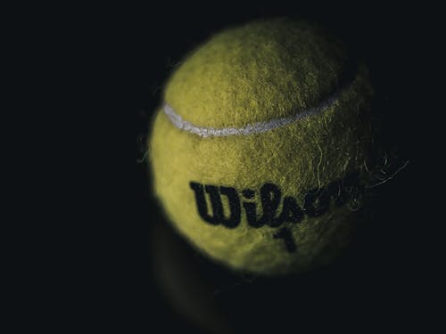 Green Tennis Ball in Close Up Photography