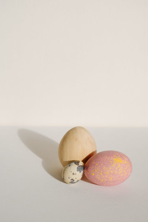 Quail Egg and Easter Eggs on a White Background