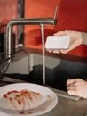 Person Holding White Tissue Paper