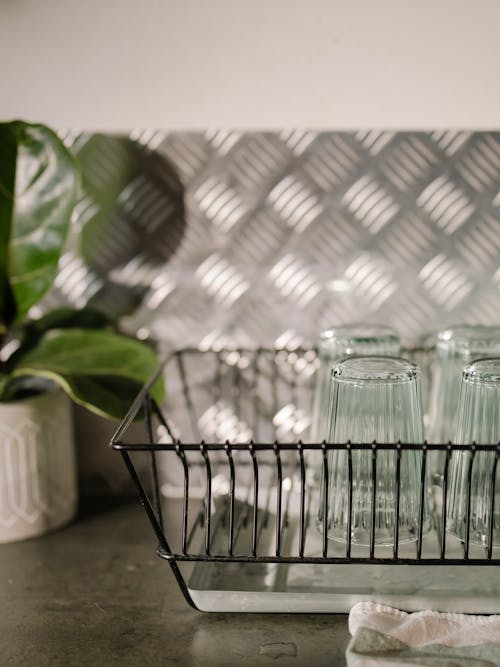 Free Clear Drinking Glasses on a Dish Rack Stock Photo