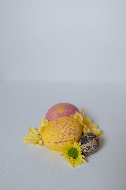 Pink and Yellow Easter Eggs a Quail Egg and Flowers