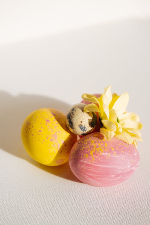 Pink and Yellow Easter Eggs a Quail Egg and a Flower