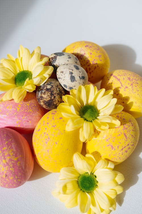 Pink and Yellow Easter Eggs Quail Eggs and Flowers