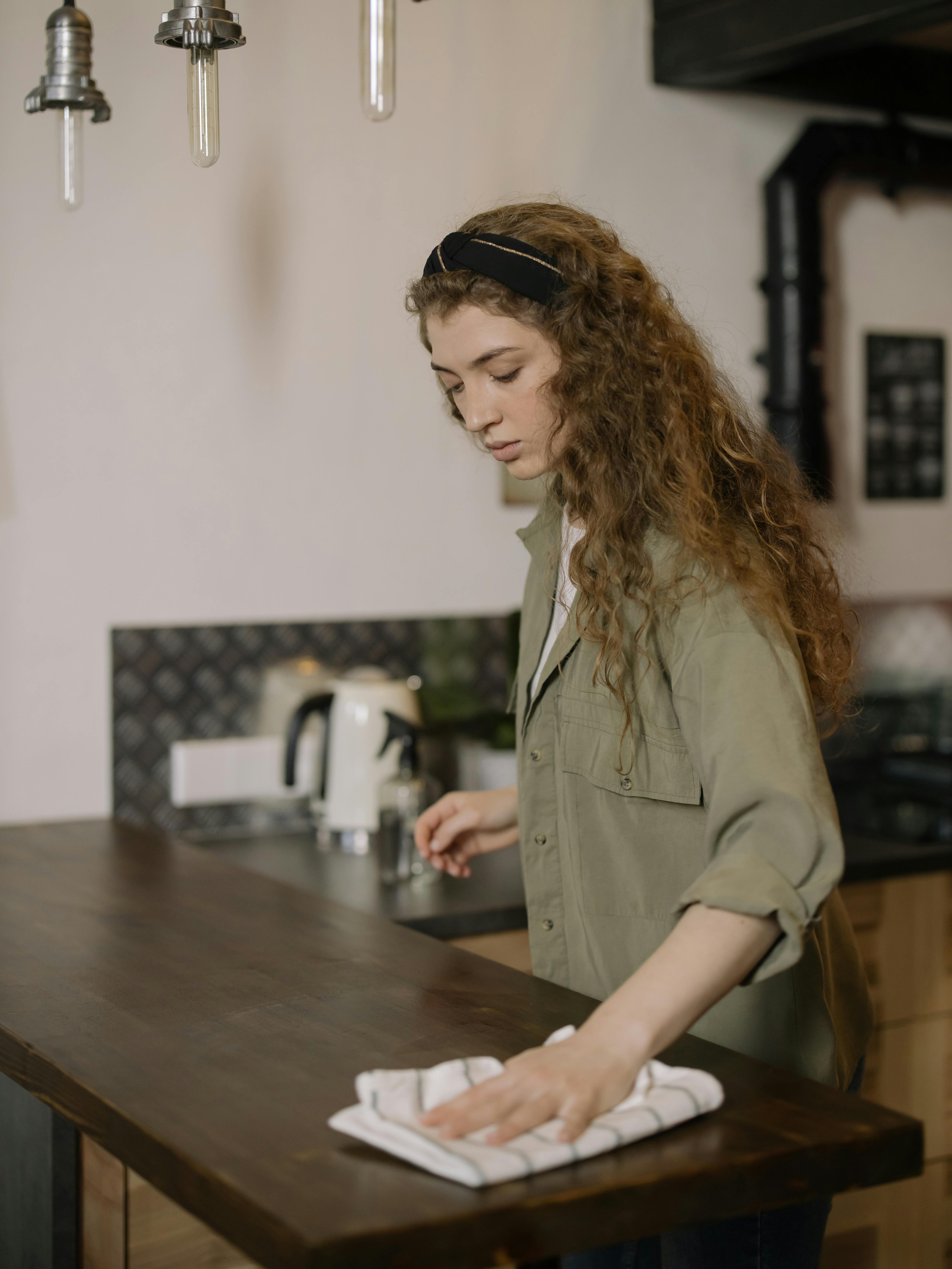 woman in brown coat sitting by the table