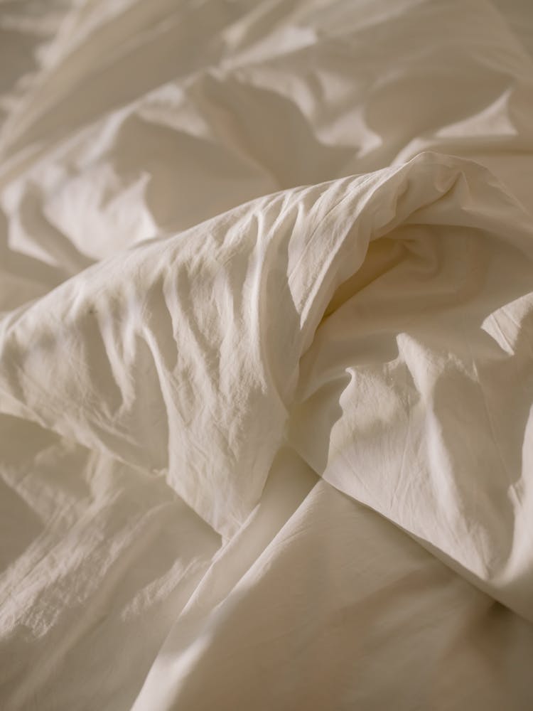 White Textile On White Textile