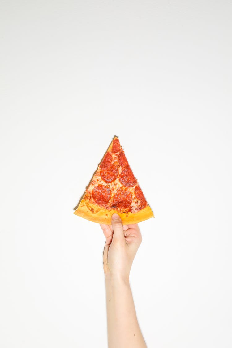 Pizza Slice In Hand