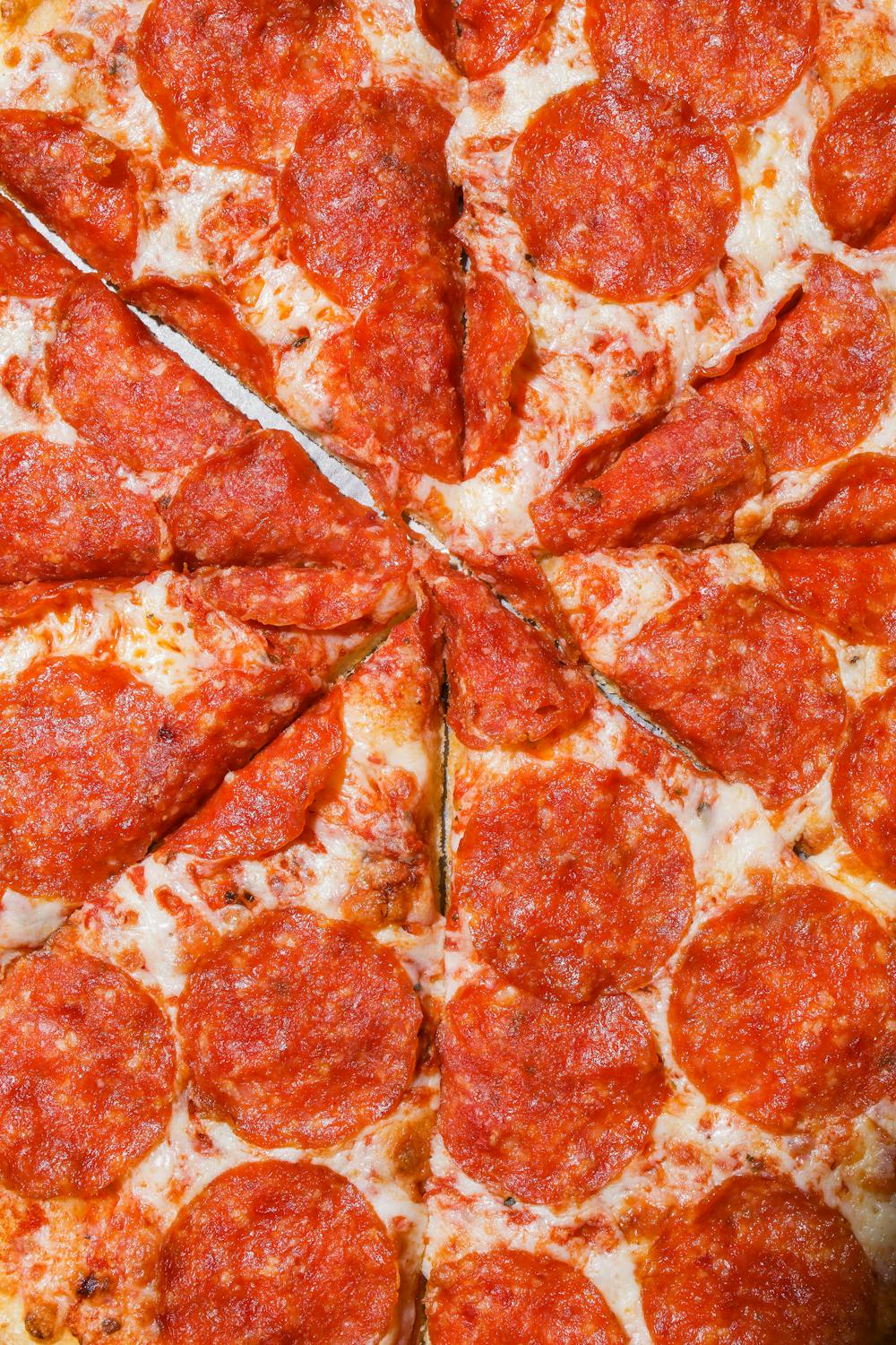 Sliced Pepperoni Pizza In Close-up View · Free Stock Photo