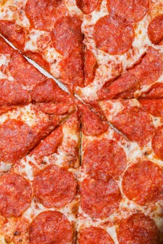 Close-up of a cheesy pepperoni pizza with mouth-watering toppings.