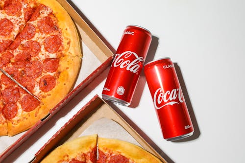 Free Coca Cola Cans Beside Pizza Stock Photo