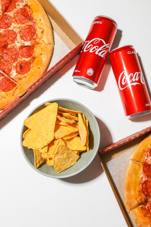 Gratis stockfoto met chips, coca cola, frisdrankje