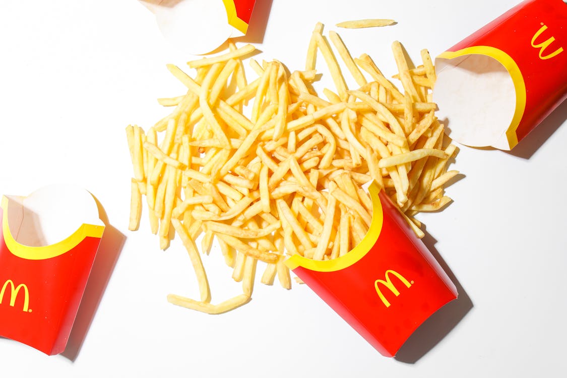 Free Mcdonalds Fries on White Table Stock Photo