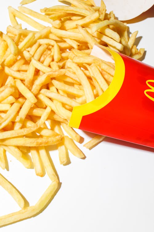 Free Mcdonalds Fries on White Surface Stock Photo