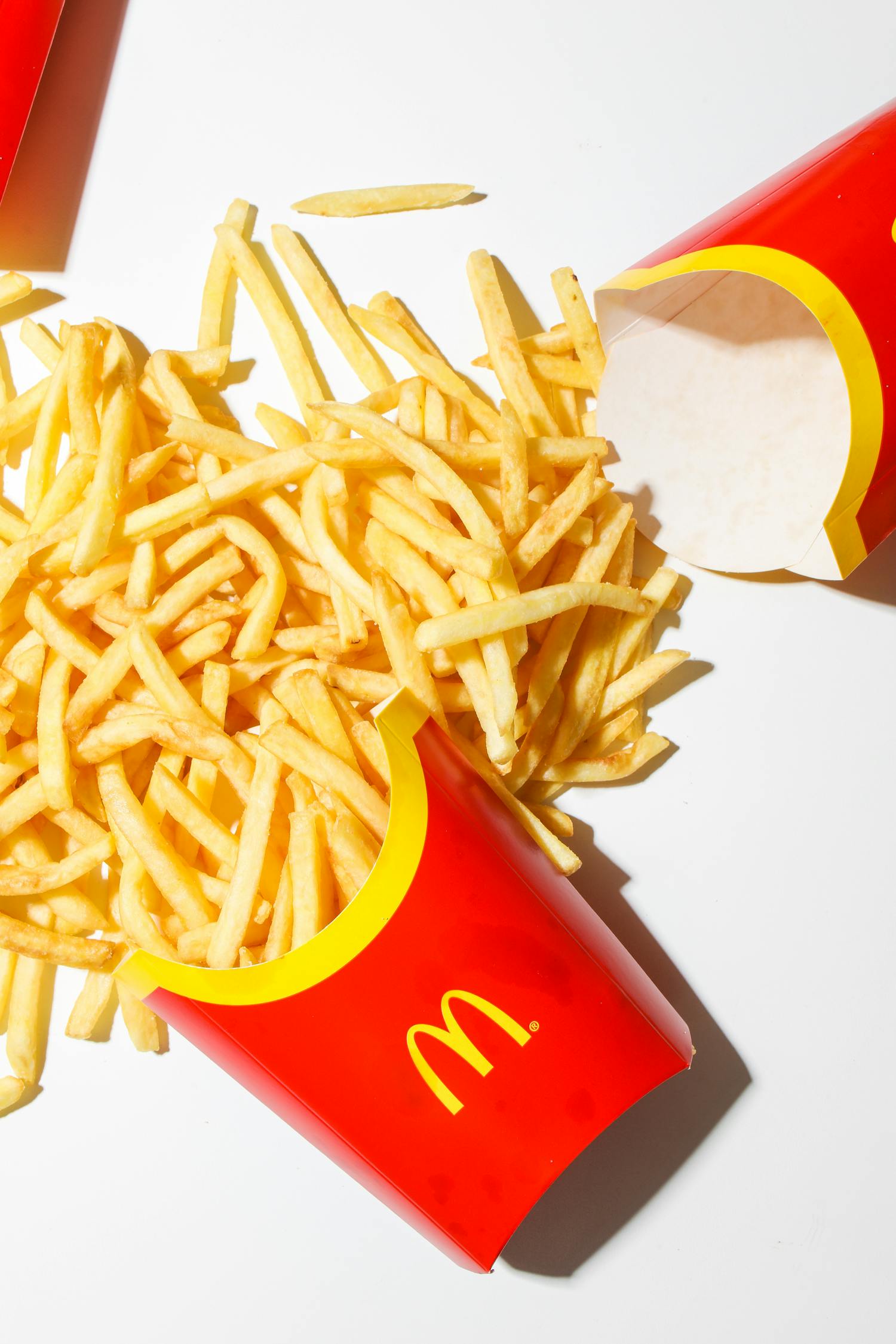 Mcdonalds Fries on White Table · Free Stock Photo