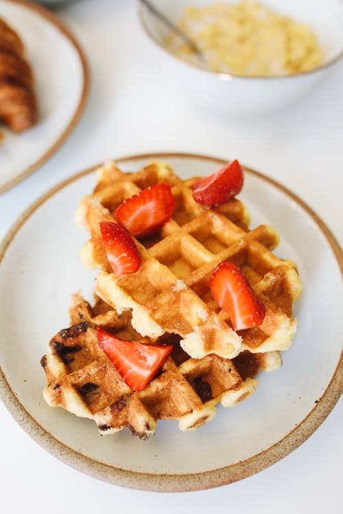 Free Sliced Strawberries on Top of the Waffles Stock Photo