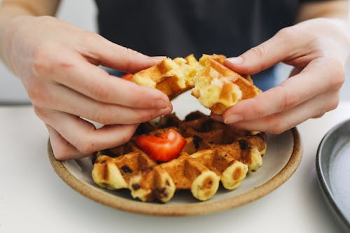 Free A Person Holding a Waffle Stock Photo