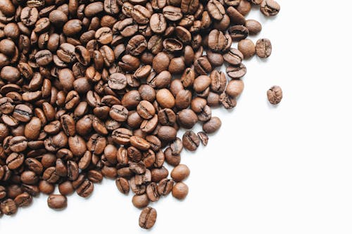 Free Brown Coffee Beans on White Surface Stock Photo