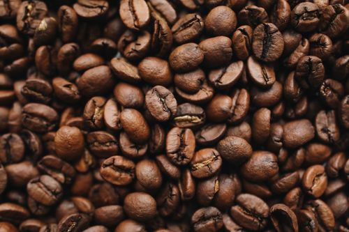 Free A detailed close-up view of aromatic roasted coffee beans, perfect for beverage-related content. Stock Photo