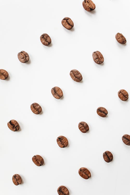 Free Brown Coffee Beans On White Surface Stock Photo