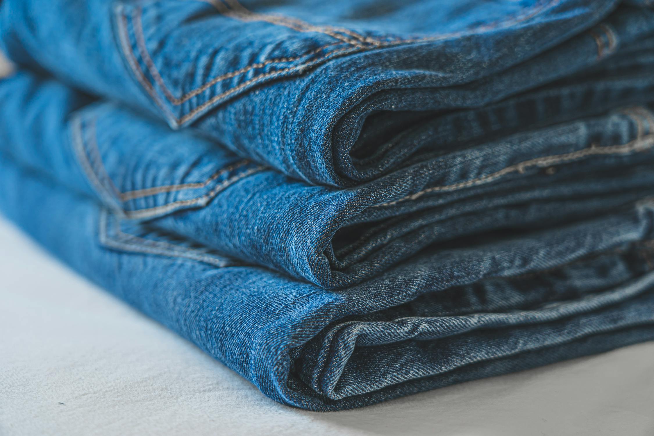 Blue Denim Pants on Table · Free Stock Photo