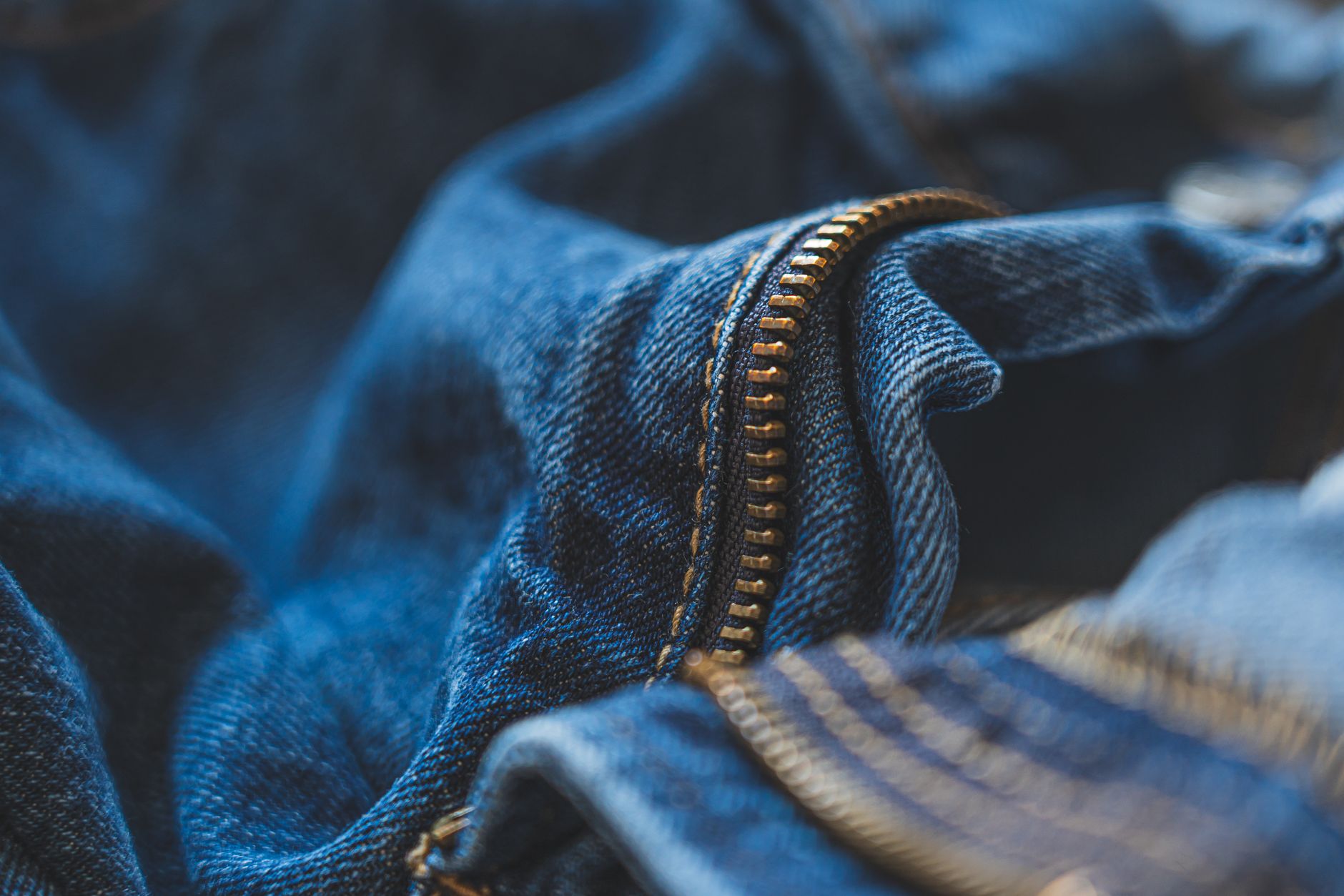 Comparison of three pocket bag fabrics showing a lightweight sheer polyester, a medium-weight woven cotton, and a heavy canvas-interfaced fabricSOURCE: Pexels