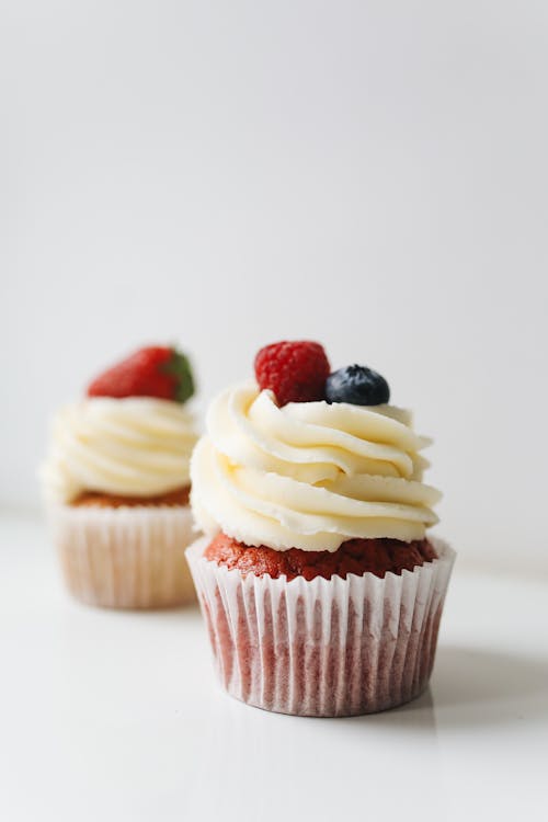 Free Red Velvet Cupcake with Creamy Icing on Top  Stock Photo