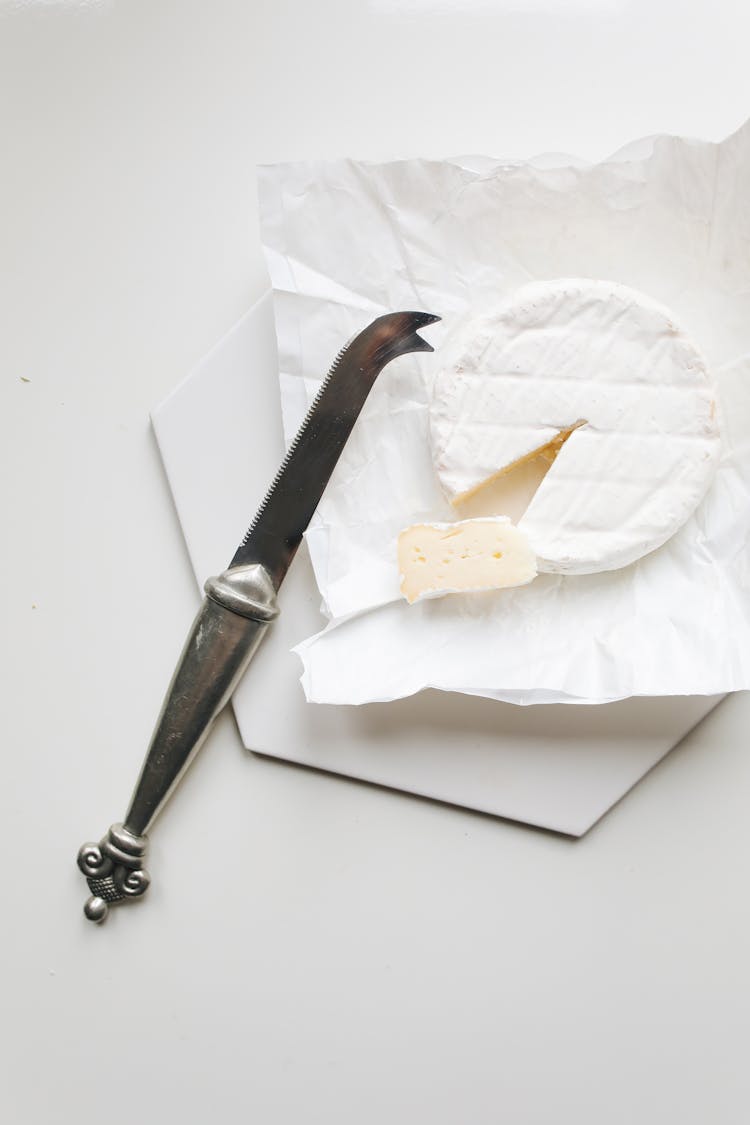 Photo Of Knife Near Camembert Cheese