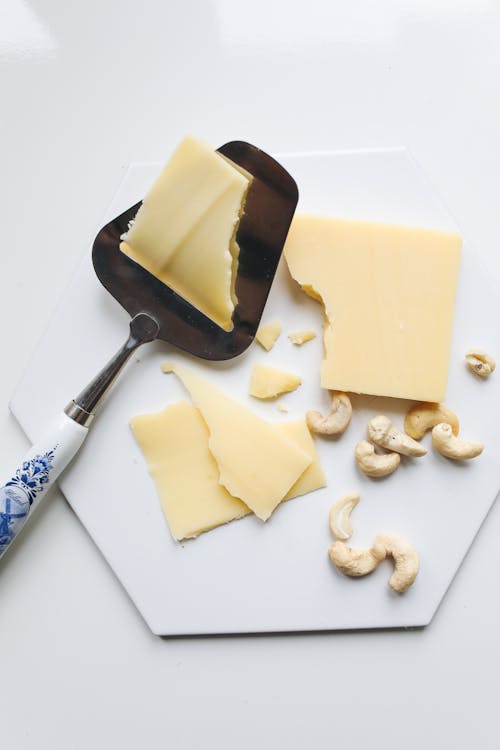 Photo Of Sliced Cheese On A Spatula