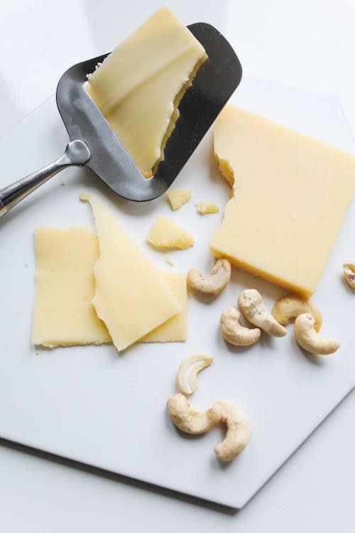 Free Photo Of Sliced Cheese On Spatula Stock Photo