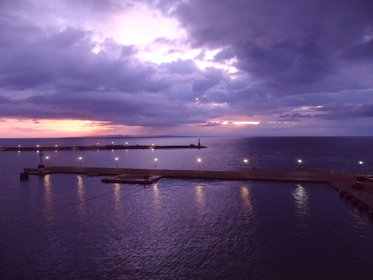 Person holding a smartphone taking a photo of a healthy meal bowl for social media