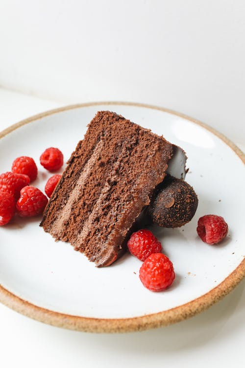 Close-Up Photo Of Sliced Chocolate On A Ceramic Plate