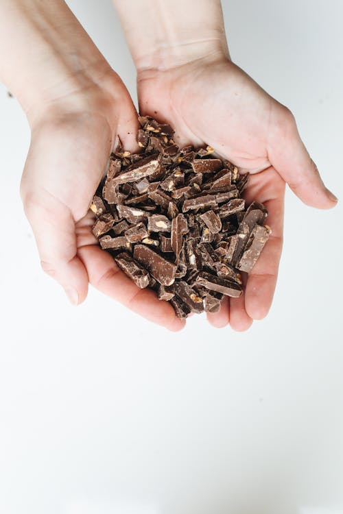 Photo Of Person Holding Slices Of Chocolates