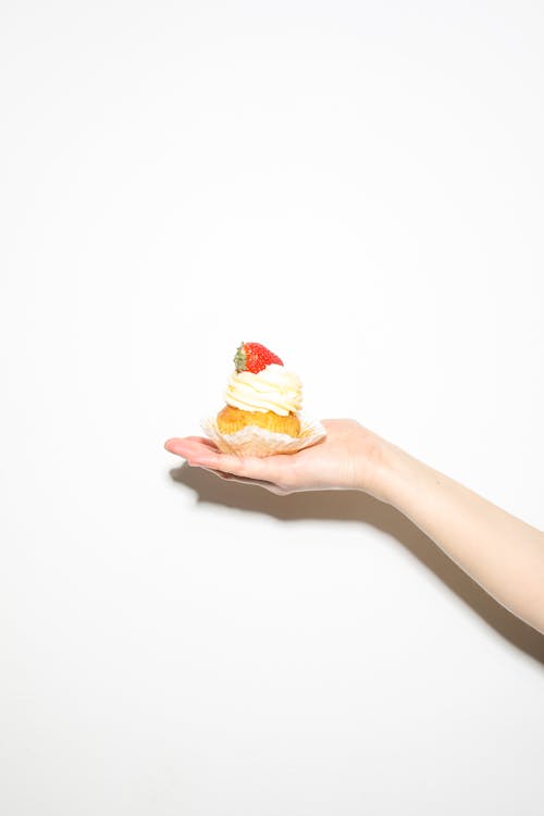 Free Person Holding Cupcake Stock Photo