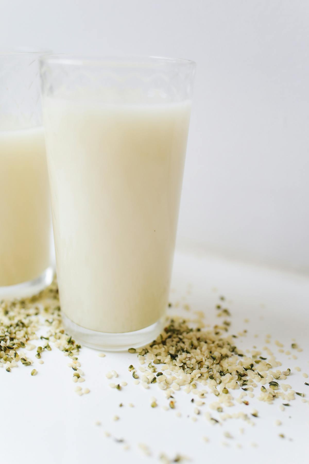 Cooked whole grains in a pot being fluffed with a fork