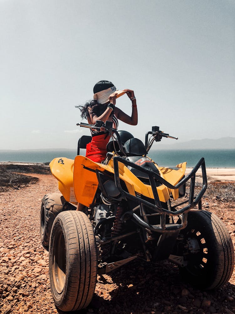 Woman Sitting On Quad