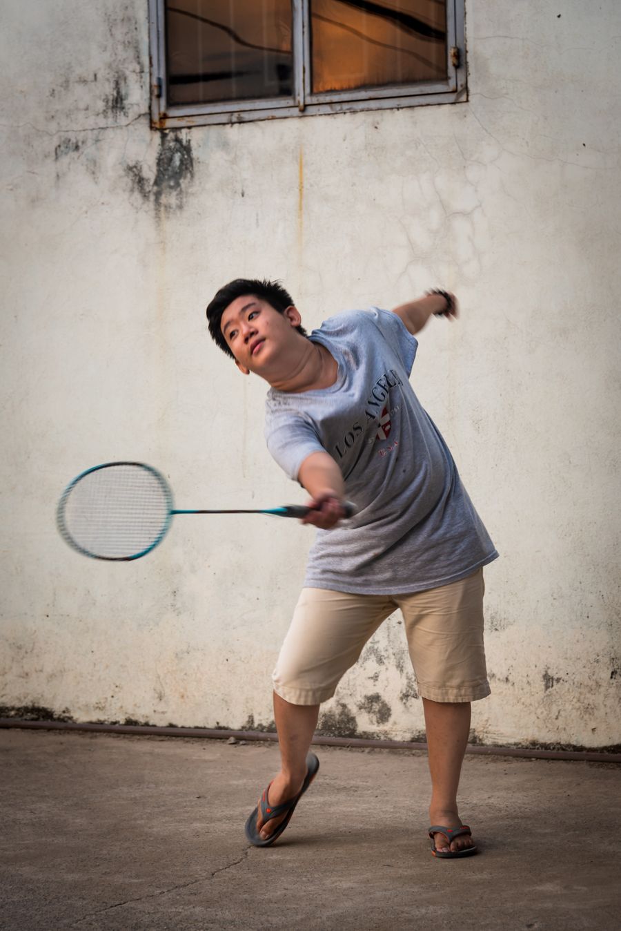 Portrait of a Wildcats club member holding a racket