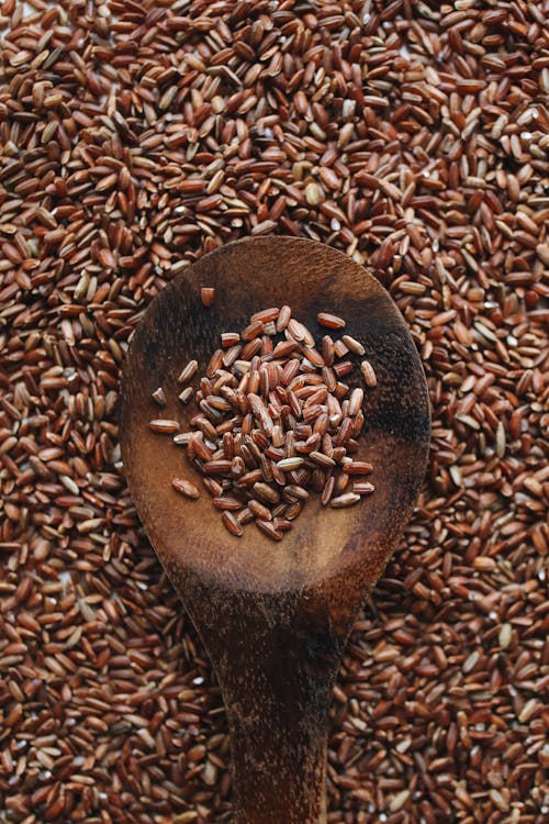 Free Close-Up Photo Of Brown Rice On Wooden Spoon  Stock Photo