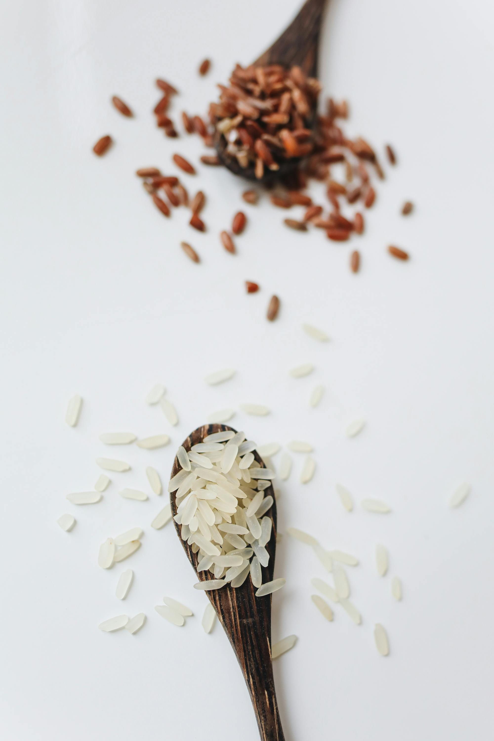 photo of rice on wooden spoon