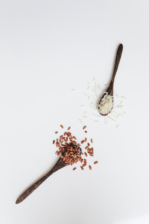 Free Photo Of Assorted Rice Grain On Wooden Spoon  Stock Photo