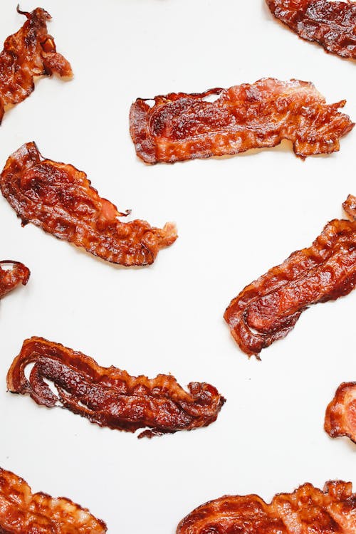 Brown Bacon Strips on White Surface