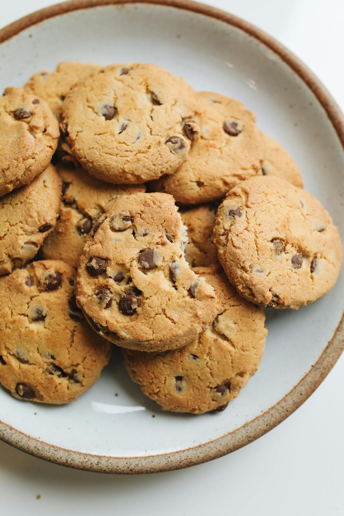 A table spread with a grain bowl, miso soup, and small dishes of fermented vegetables