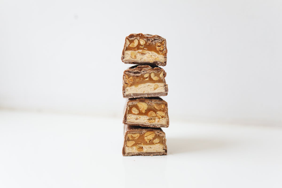 Meal prep containers filled with soup and vegetables