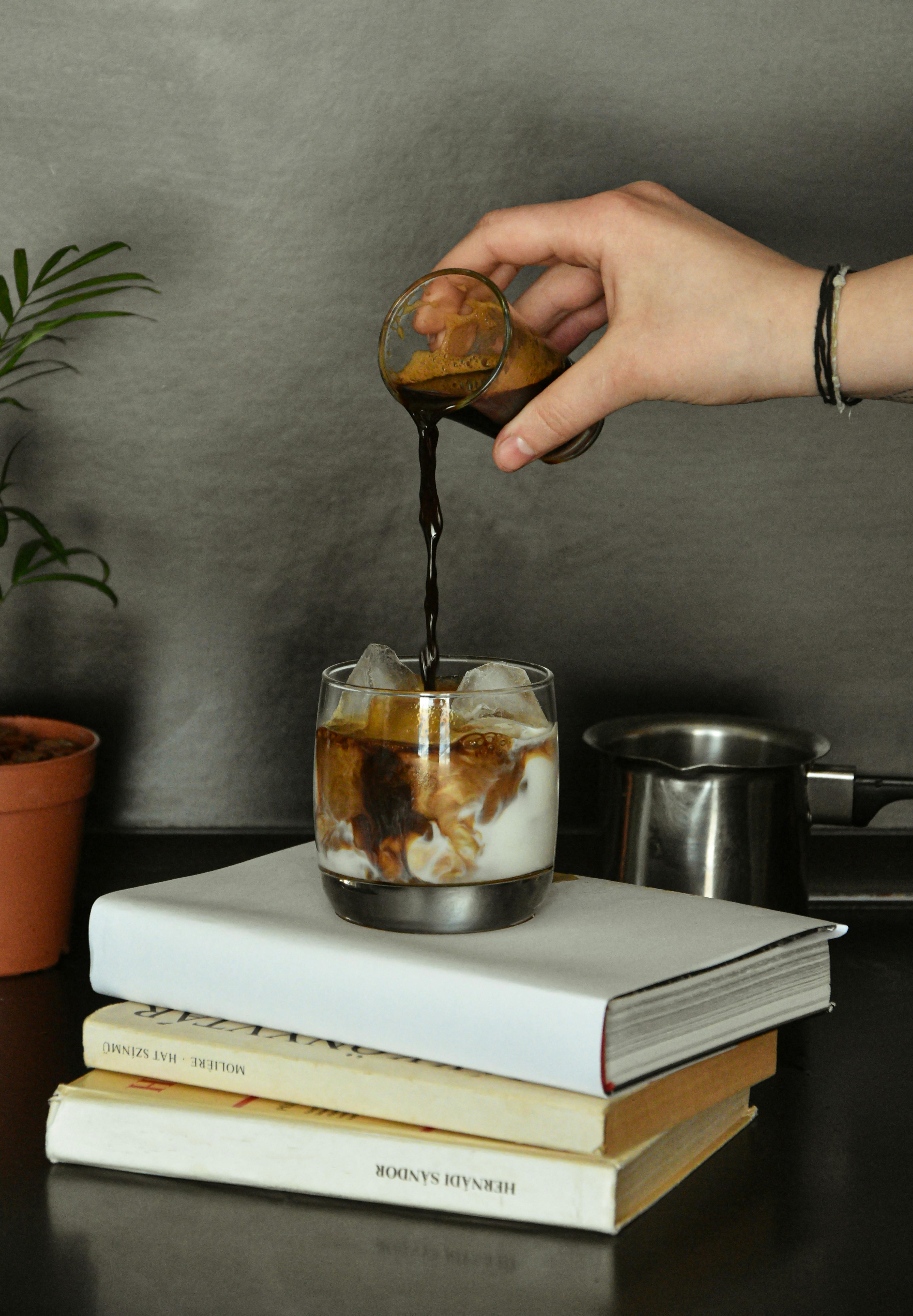 Photo Of Person Pouring Coffee by Timi Keszthelyi