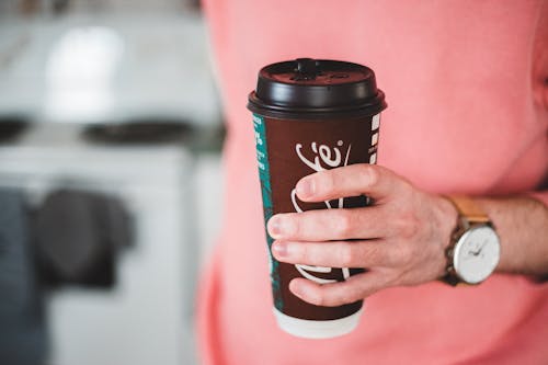 Photo Of Person Holding Disposable Cup