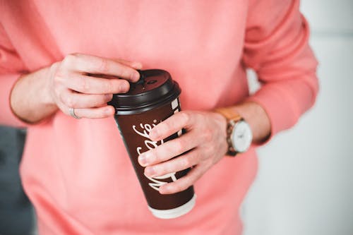 Free Photo Of Person Holding Disposable Cup Stock Photo