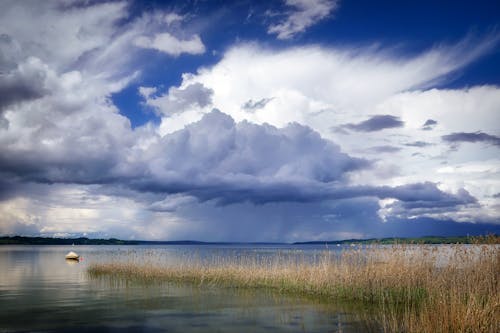 Free White Boat Under White Clouds Stock Photo