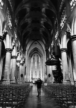 Explore the grandeur of a Gothic cathedral interior, capturing architectural beauty and religious symbolism.