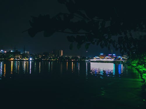 Free stock photo of city night, dark green, light reflection