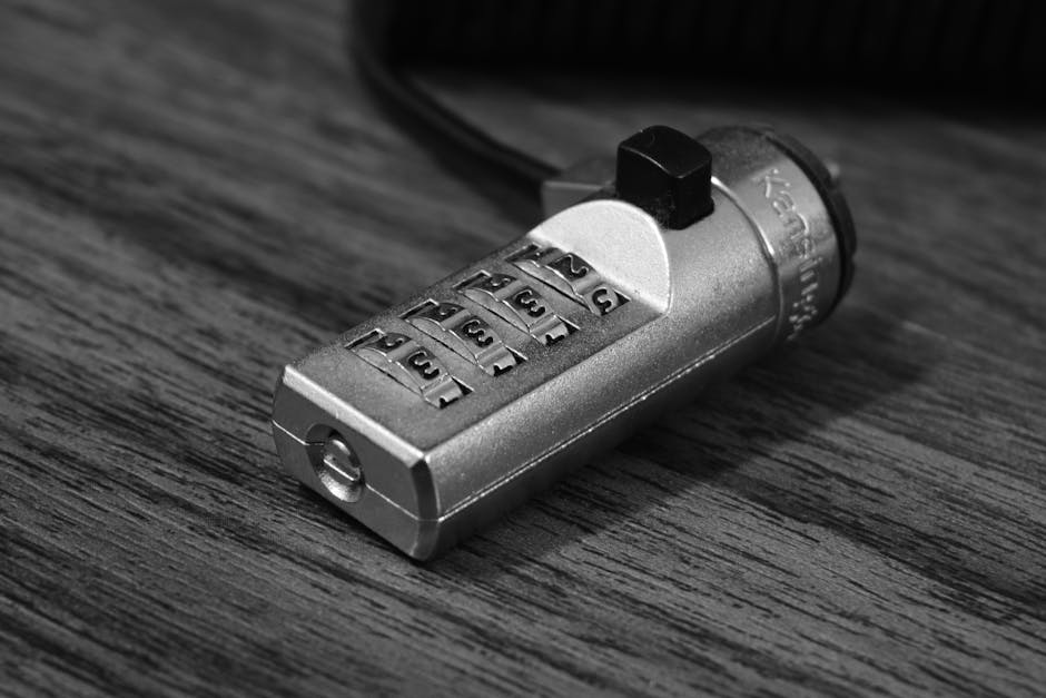 Grayscale Photography of Combination Lock for MacBook