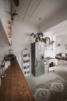 Charming kitchen featuring a rustic wooden counter and stainless steel appliances.